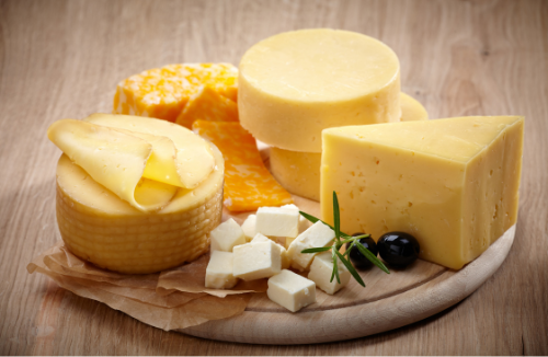 Cheese is a versatile flavor enhancer that adds a savory richness to dishes, offering diverse textures and flavors across cuisines.