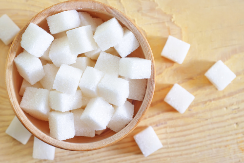 Sugar is a common flavor enhancer in food that sweetens dishes and balances acidity and bitterness. However, it should be used sparingly to avoid health issues.
