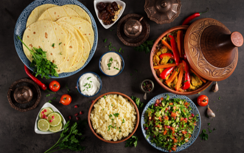 Diverse and rich food in Morocco, showcasing traditional dishes that blend sweet and savory flavors.