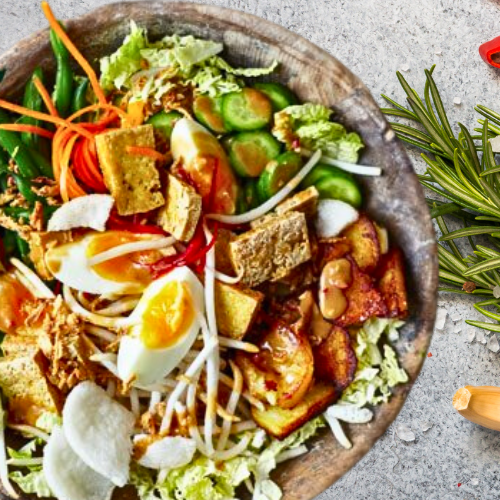 Indonesian Gado-Gado with boiled potatoes, tofu, green beans, and peanut sauce, ideal for plant-based diets in children.